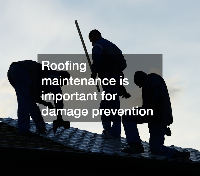 silhouettes of three roofers working on a roof